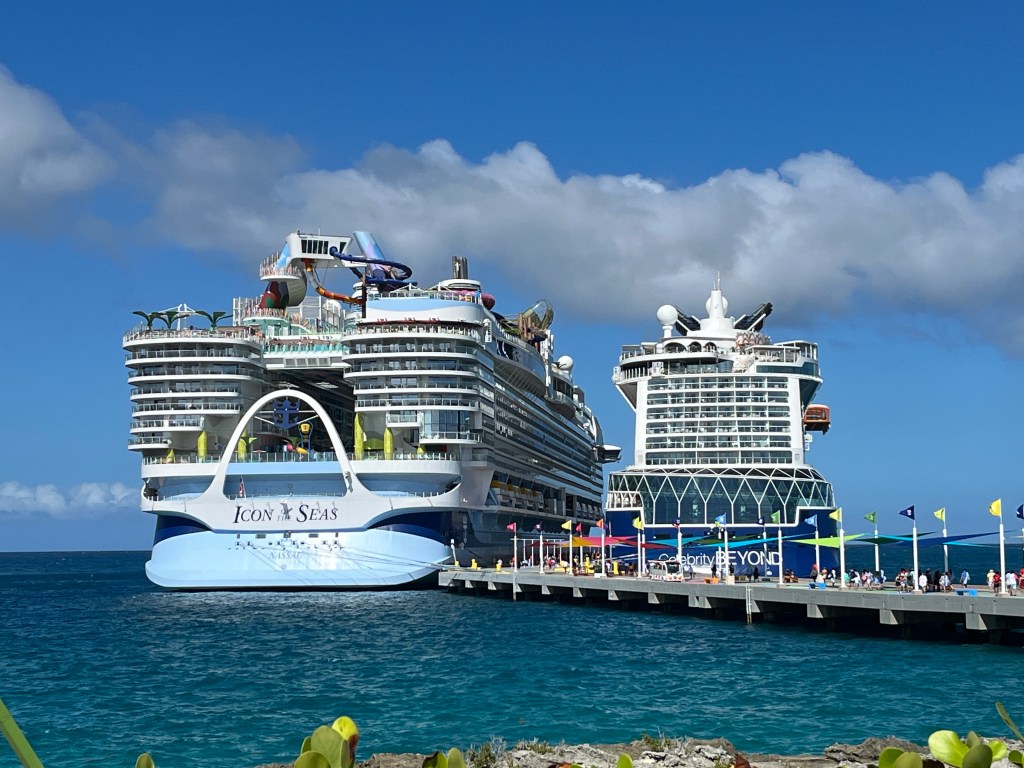 Two cruise ships, Icon of the Seas and Celebrity Beyond, docked next to each other in Cozumel. Intended to show the size difference in cruise ships.
